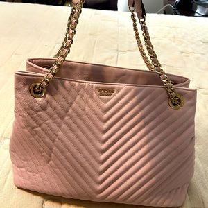 Victoria Secret purse.  It’s a light pink with black inside. Smoke free home.